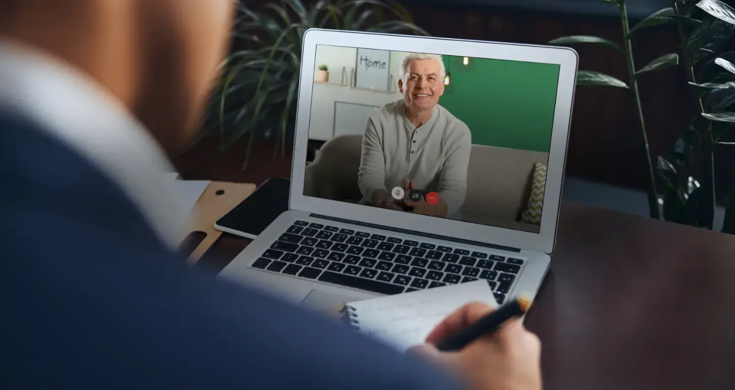 A client speaking with a financial adviser on a video call